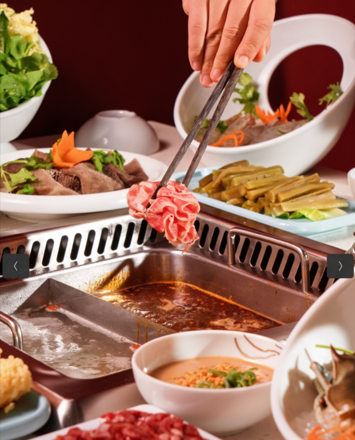 Beef being dipped into hotpot broth